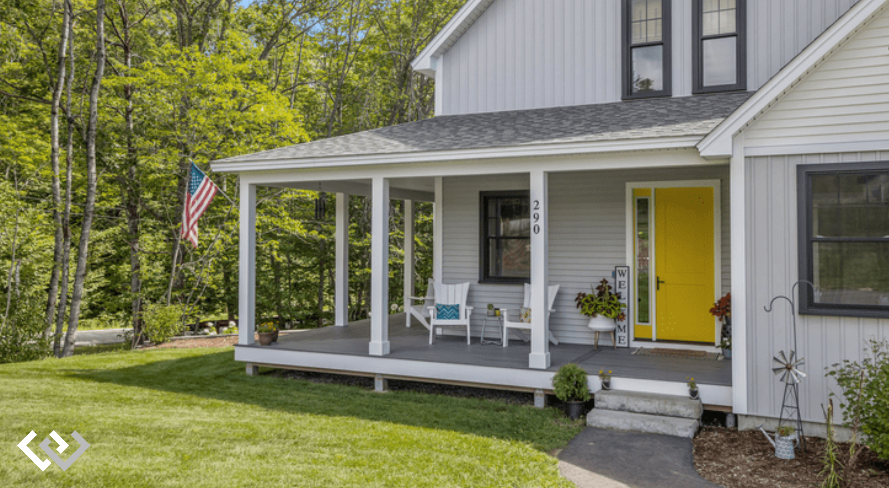 Front lawn of a house with a large porch