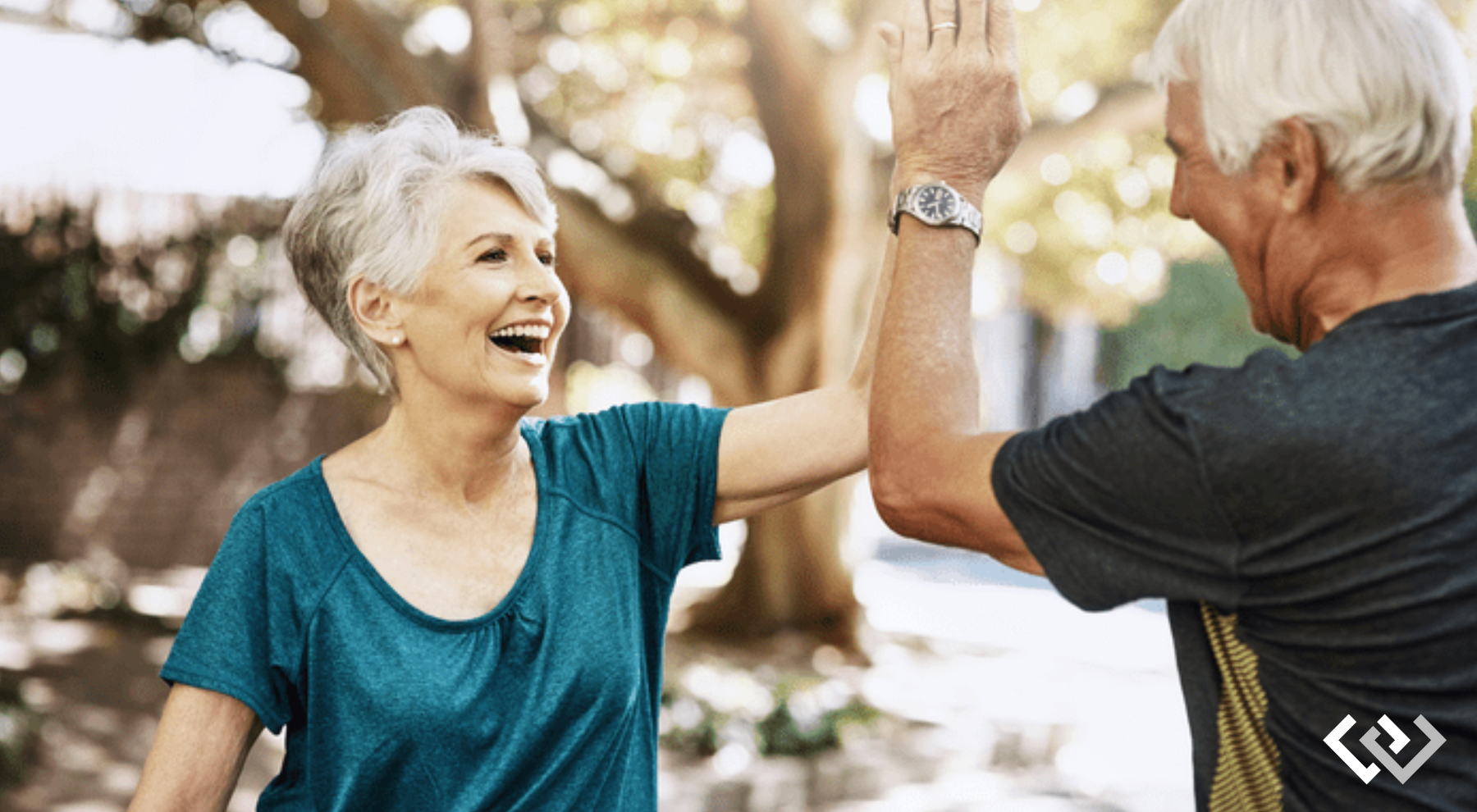 two adults high-fiving each other